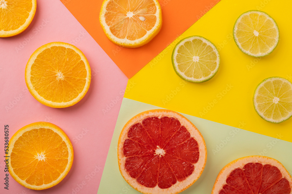 Multicolored bright citrus fruits on an abstract background. Top view.