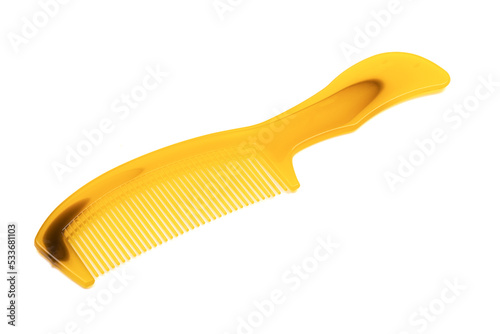 Yellow female plastic hairbrush isolated on white background.