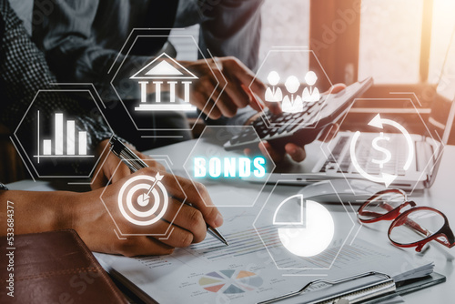 Bond Finance Banking Technology concept, usiness team analyzing income charts and graphs with bond icon on virtual screen, Trade Market Network.