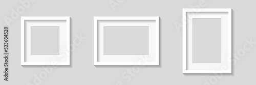 White empty photo or picture frames with mats and shades isolated on gray background. Vector illustration. Wall decor. Rectangle and square vertical and horizontal photo frame