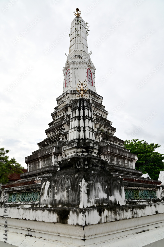 The Old Big Pagoda in a Thai temple is one of famous tourist attractions in Thailand with Blue Sky and White Clouds background.