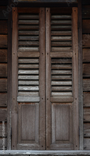 an old wooden window of a Malay house