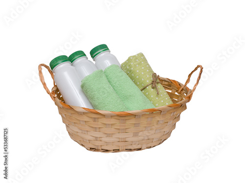 basket with plastic bottles and green towels