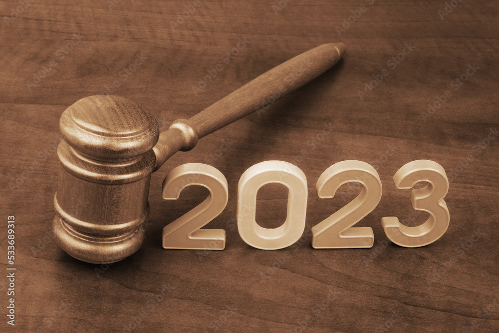Wooden judge gavel with numbers 2023. Concept of court in year 2023. - obrazy, fototapety, plakaty 