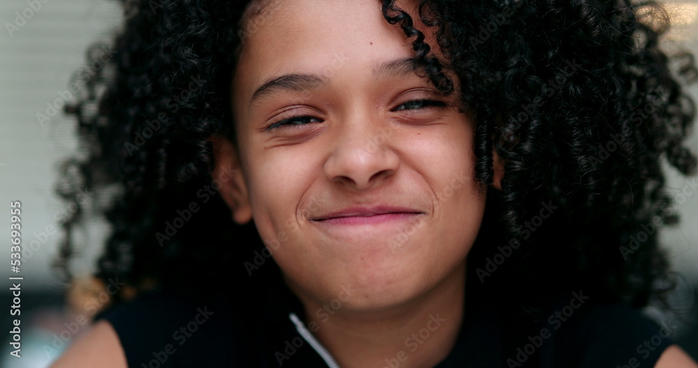 Happy black preteen child girl portrait face close-up Happy black preteen child girl portrait face close-up