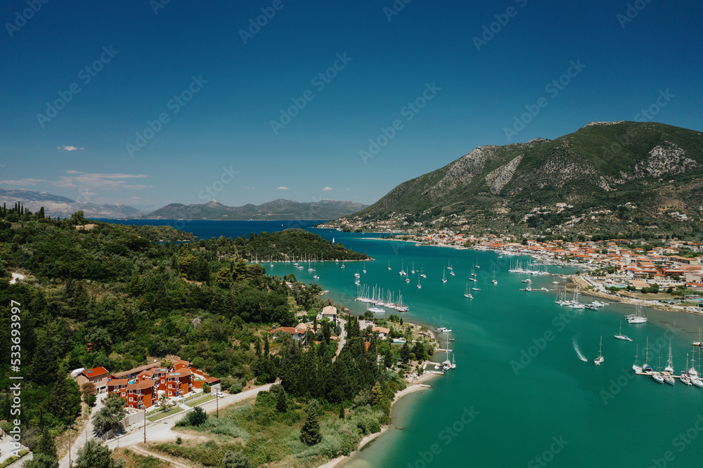 Popular Tourist destination. Bay with boats on Lefkada island. Nydri village.