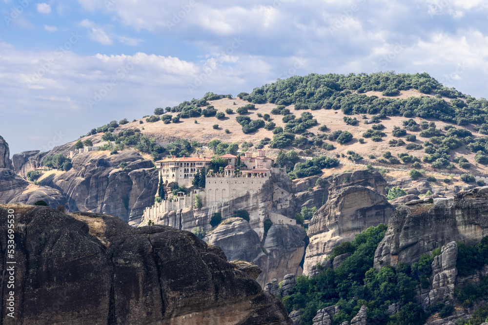 The monasteries are built on rock pinnacles of deltaic origin, called Meteora, rising over 400 m above the Thessalian plain, Greece, religious travel in Europe The monasteries are built on rock pinnacles of deltaic origin, called Meteora, rising over 400 m above the Thessalian plain, Greece, religious travel in Europe
