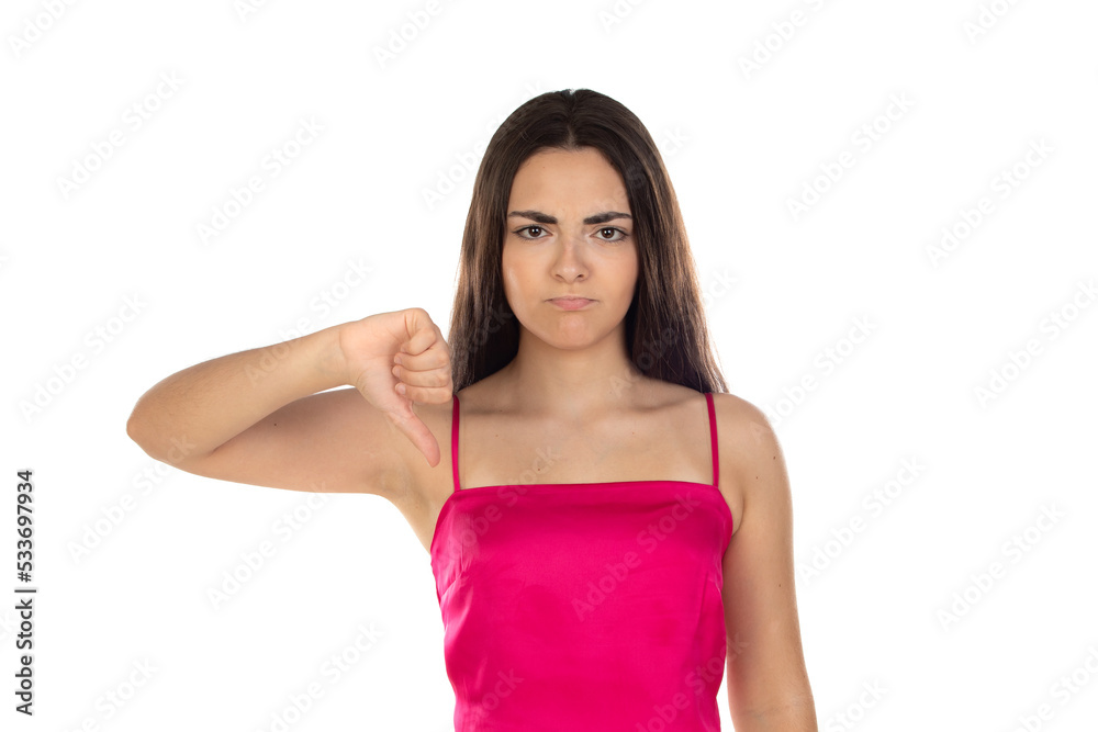 Brunette teenager girl showing thumbs down with a serious look Brunette teenager girl showing thumbs down with a serious look