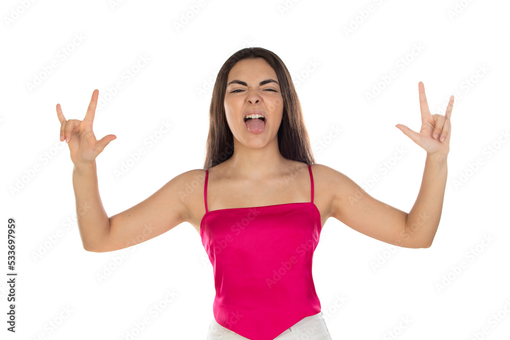 Brunette rebel teenager girl showing rock gesture with fingers wearing pink top Brunette rebel teenager girl showing rock gesture with fingers wearing pink top