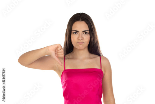 Brunette teenager girl showing thumbs down with a serious look © Gelpi