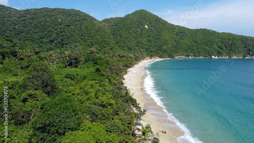 Santa Marta Colombia , Tayrona Natural Park Caribbean sea ocean - Drone aerial view of amazing  sand beach and  forest full of palm trees vegetation - deserted and paradise beach for summer vacation © andrea