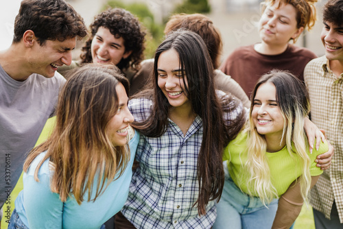 Diverse young people having fun outdoor - Cheerful students outside of university