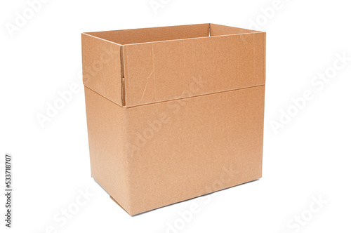 Open cardboard box close up isolated on a white background © unclepodger