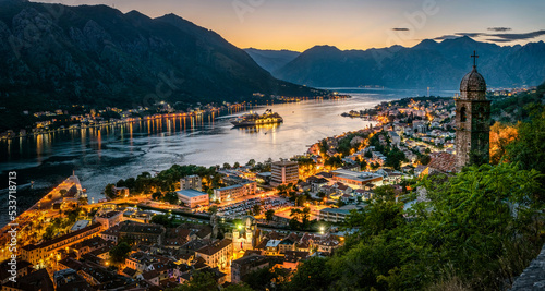 Fototapeta Naklejka Na Ścianę i Meble -  Panoramic evening view of the church, the old town and the Bay of Kotor from above. The Bay of Kotor is the beautiful place on the Adriatic Sea. Kotor, Montenegro.