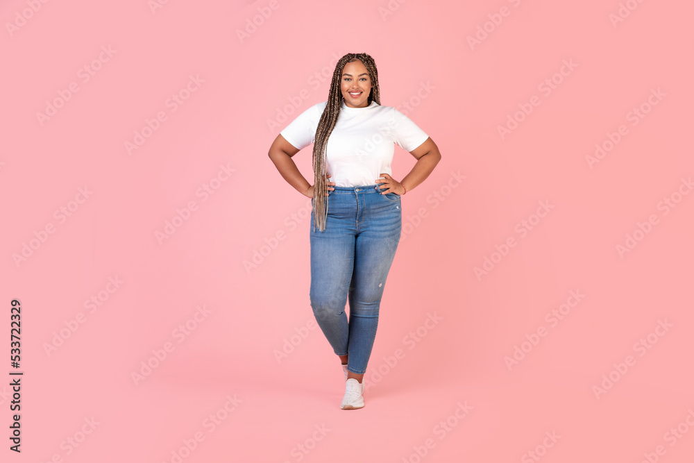 Happy African American Oversized Black Woman Standing Over Pink Background Happy African American Oversized Black Woman Standing Over Pink Background
