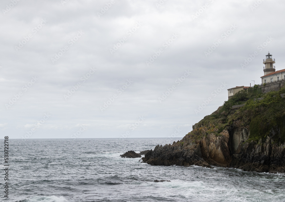 Storm as seen from the coast, lighthouse on the right Storm as seen from the coast, lighthouse on the right
