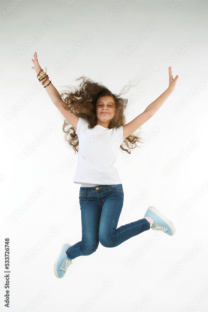 A teenage girl on a pure white background. Move or jump. A teenage girl on a pure white background. Move or jump.