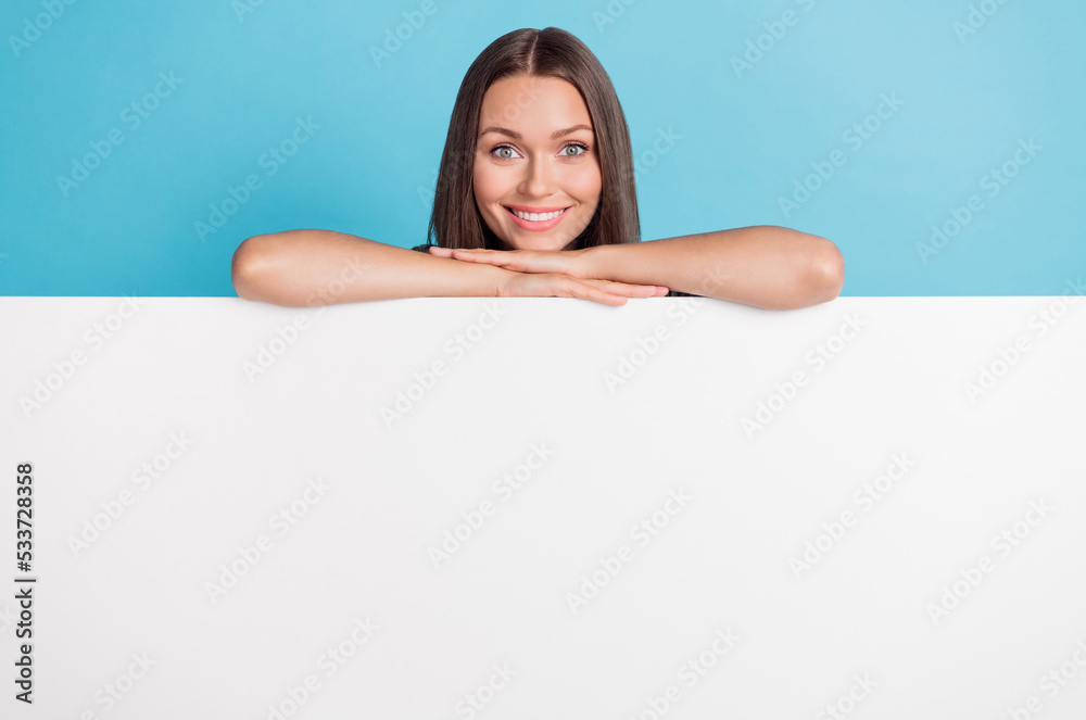 Portrait of nice pretty lovely girl with straight hairdo dressed striped t-shirt hands chin on banner isolated on blue color background Portrait of nice pretty lovely girl with straight hairdo dressed striped t-shirt hands chin on banner isolated on blue color background