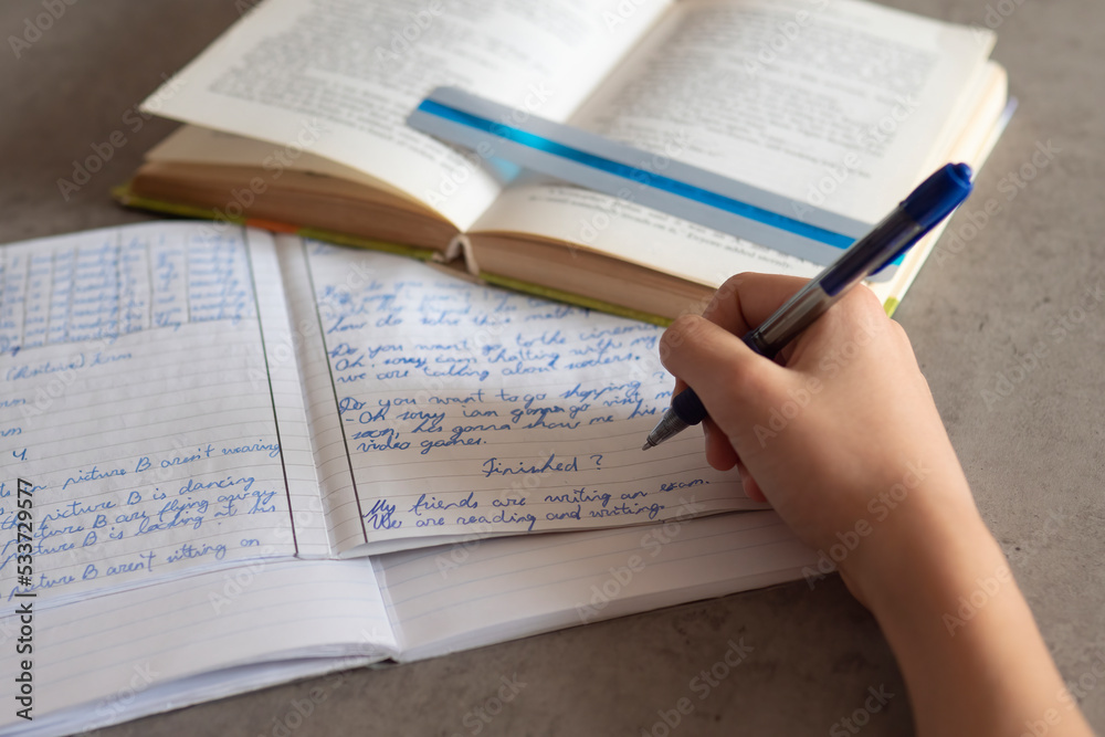Kid affected by dyslexia doing homework, reading book using colorful overlay strip. Education, learning disability, reading difficulties concept Kid affected by dyslexia doing homework, reading book using colorful overlay strip. Education, learning disability, reading difficulties concept