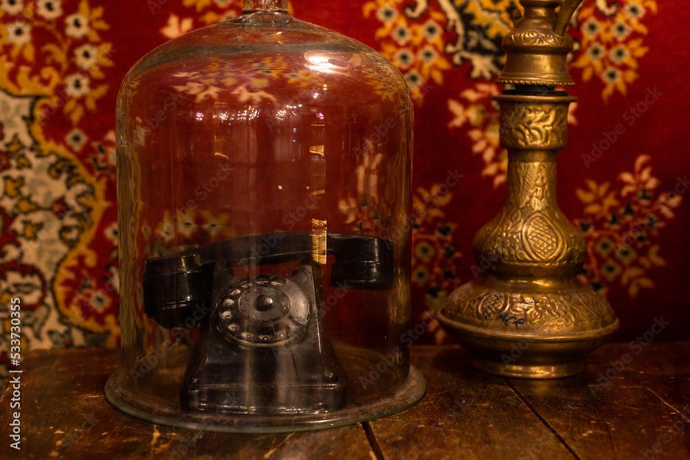 Retro telephone on table in front carpet background Retro telephone on table in front carpet background