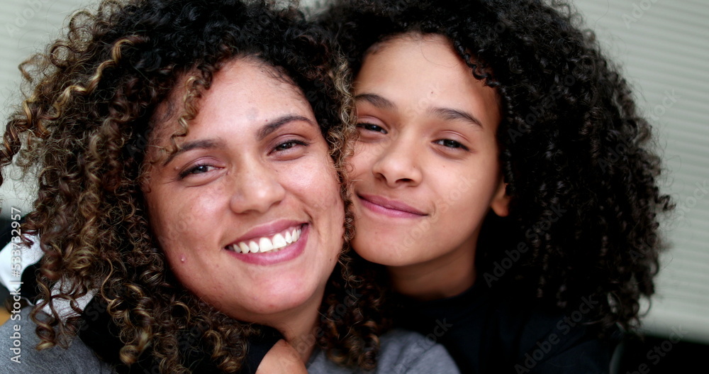 Mother and daughter posing to camera together Mother and daughter posing to camera together