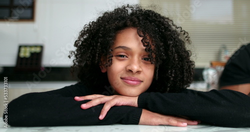 Mixed race preteen girl smiling. Portrait hispanic child close-up smile