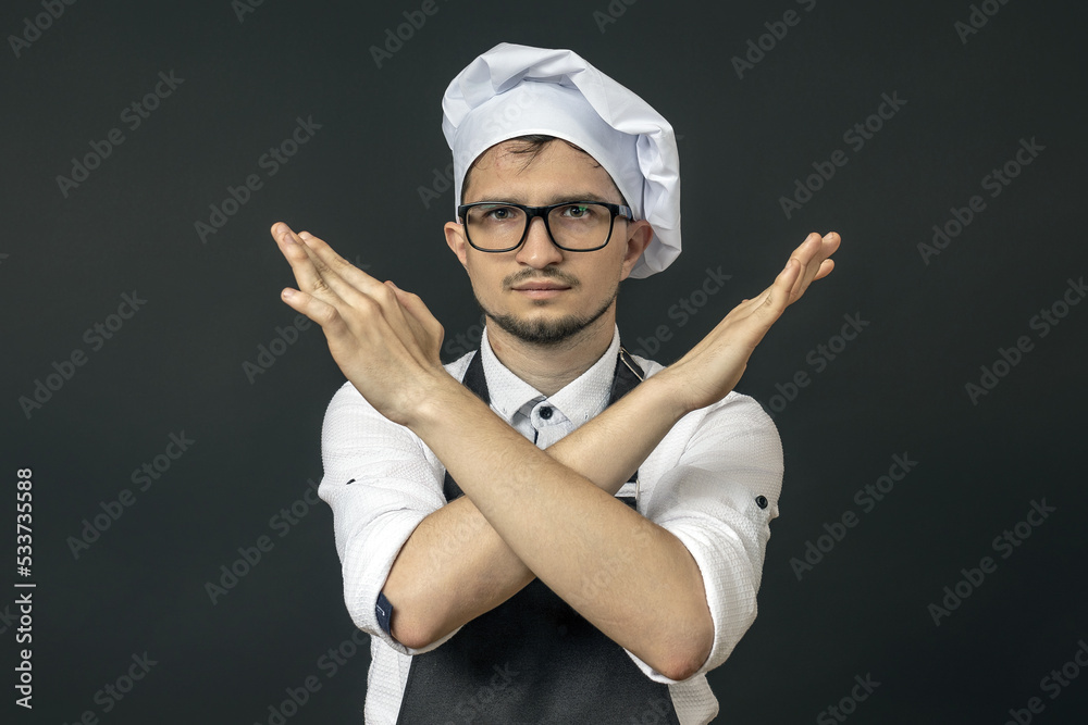 Naklejka premium the chef has his arms crossed in front of him he wants to stop all this. he's had enough