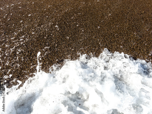Sea foam surf on the sand close-up. © index74