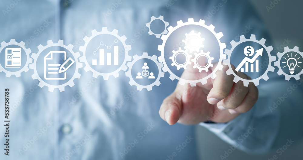 Manager operations management involving business process and workflow, problem solving, high performance, monitoring and evaluation, quality control. Concept with manager touching gears and icons. Manager operations management involving business process and workflow, problem solving, high performance, monitoring and evaluation, quality control. Concept with manager touching gears and icons.