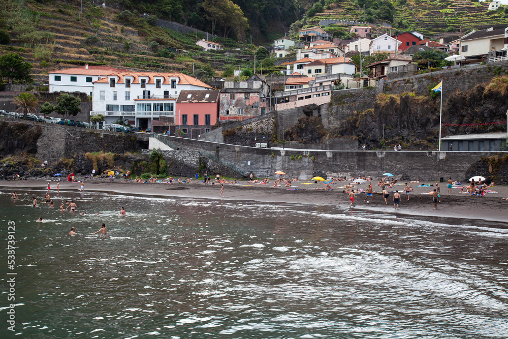 Black sandy beach and bathing bay of Seixal,  Madeira, Portugal, Europe