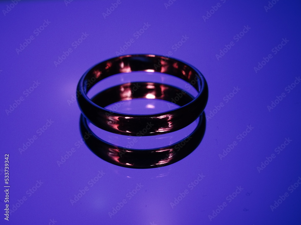 Rings with fire reflection on blue background Rings with fire reflection on blue background