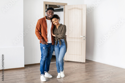 Loving Black Spouses Embracing Posing In New Home