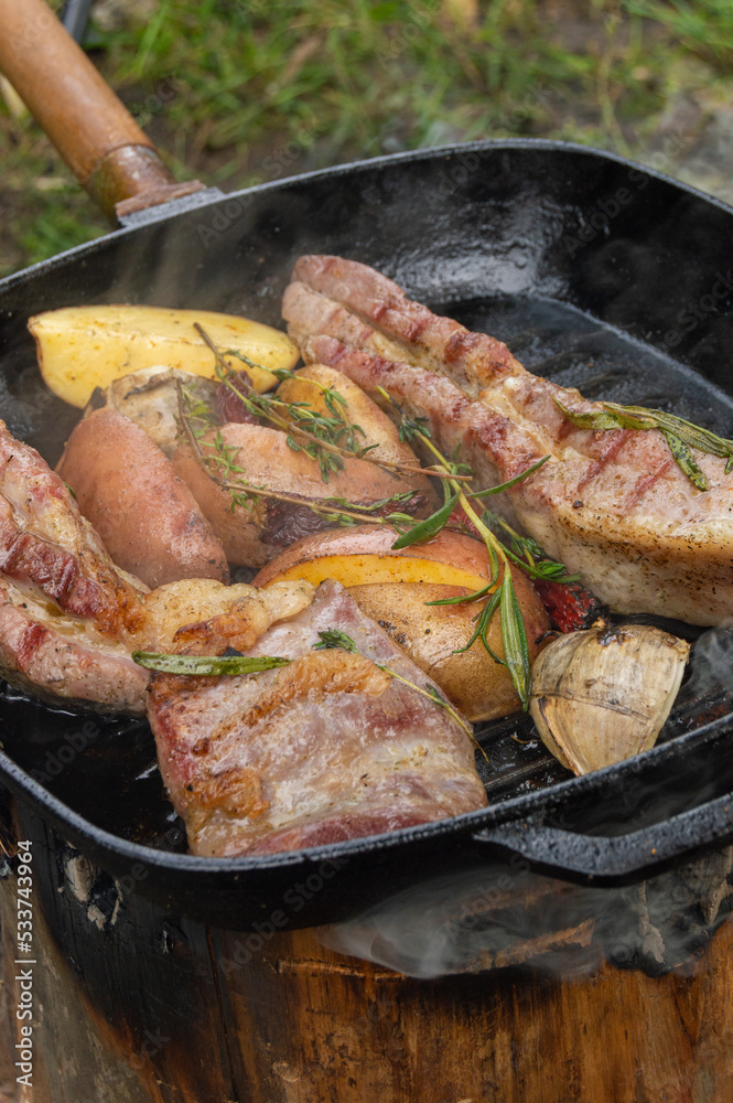 Grilled ribs with garlic peppers and herbs with potato Grilled ribs with garlic peppers and herbs with potato