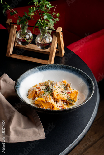 Juicy pasta with rapan cheese and herbs