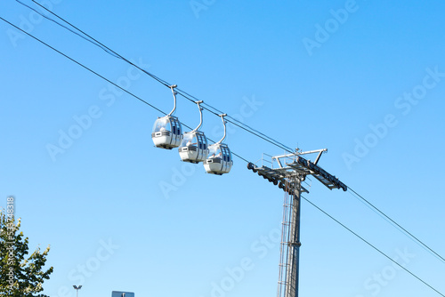 three modern cable cars in Samsun,Turkey. Retro style vintage collection. Nostalgia Time. Turkish name is Teleferik. People ride in cabins on a cable car.