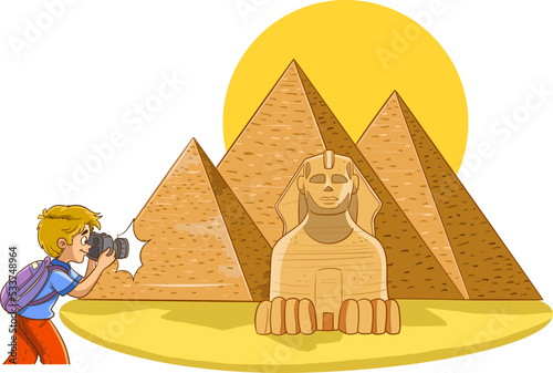 photographer boy takes picture of egyptian pyramids
