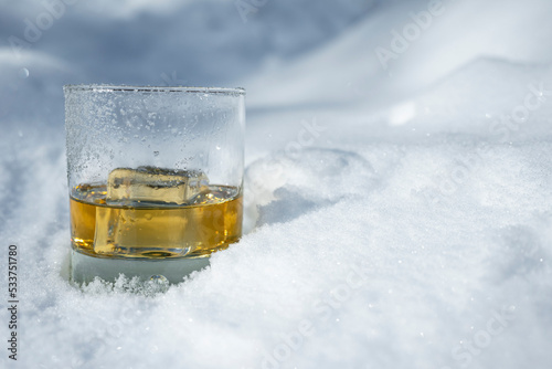 Whiskey on the rocks in the snow