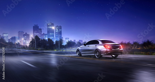 Generic car driving at night on a suburban highway with an city landscape and mountains in the background. 3d rendering