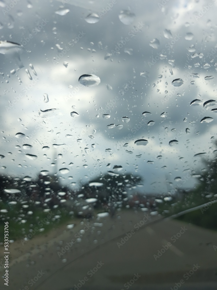 rain drops on window - water drops on car window - rain drops - close up of rain drops