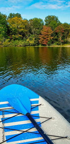 paddleboard on the lake in fall photo