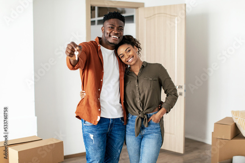 African American Millennial Couple Showing Key Posing In New House
