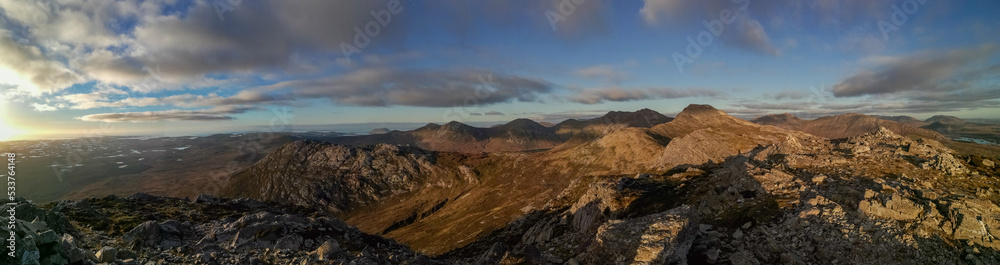 panorama of sunset over the Twelve Bens mountains in Connemara, Galway county, Connacht, Ireland in autumn
