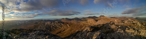 panorama of sunset over the Twelve Bens mountains in Connemara, Galway county, Connacht, Ireland in autumn