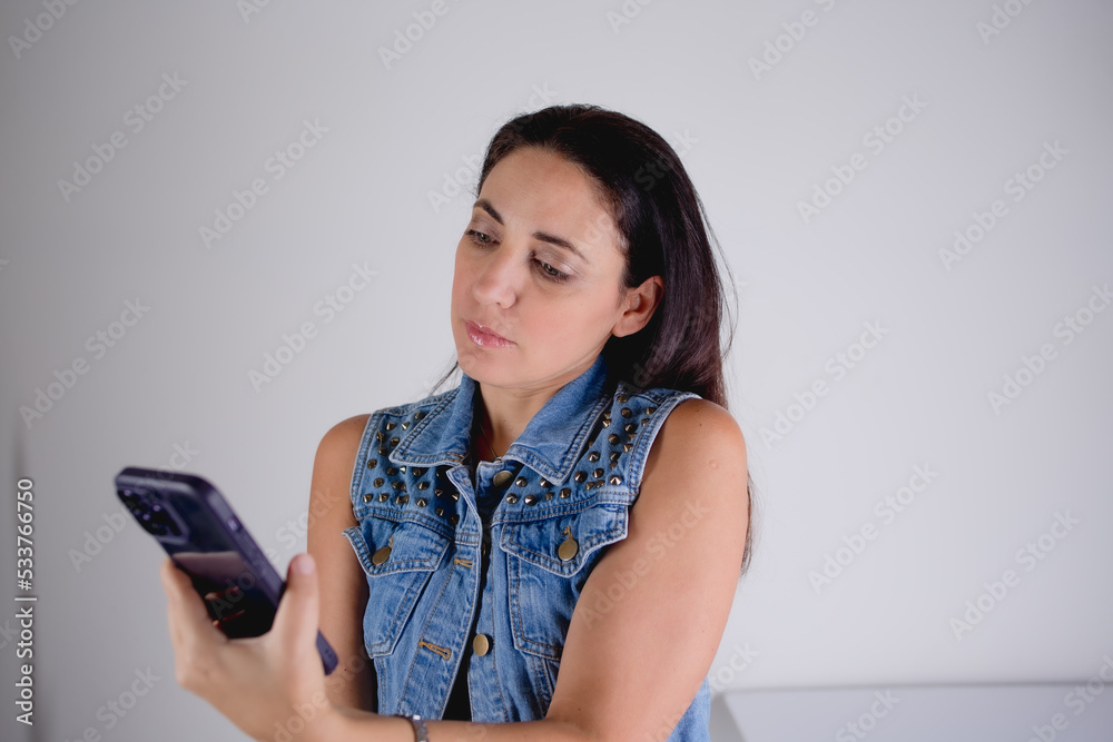 woman talking on the phone and making expression woman talking on the phone and making expression