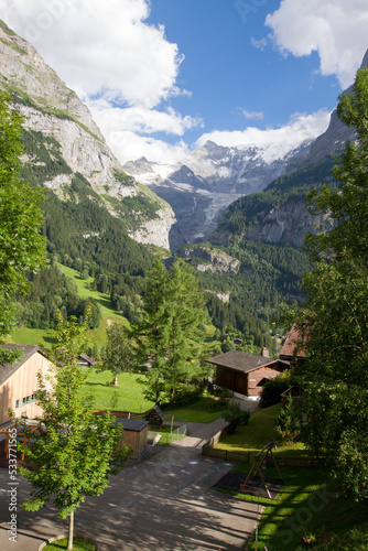 Traditional wooden houses in Swiss Alpine village below Eiger mountain