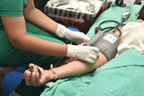 A person Donating blood and a nurse collecting it. There’s no end to the benefits of donating blood for those who need it. According to the American Red Cross, one donation can save as many as three l