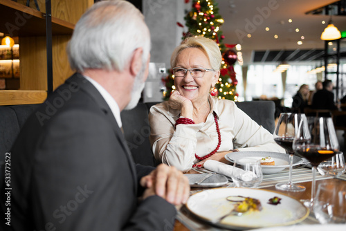 Family of two having a Christmas dinner at the bar