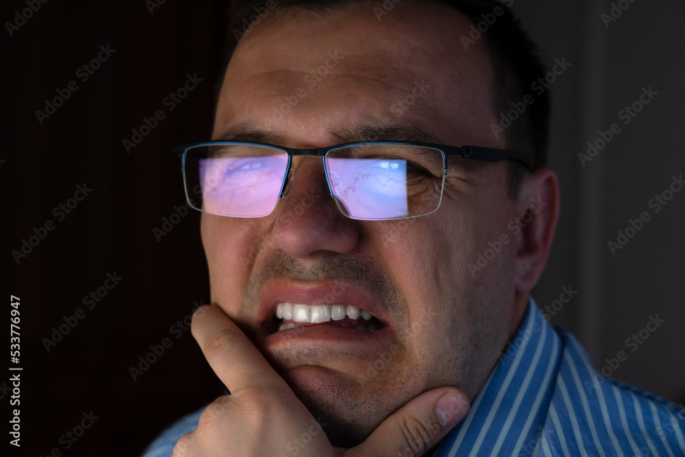 Sad upset furious angry misfortune depressed troubled crying trader touching chin screaming looking at pc screen. Concept of crisis at stock market.
