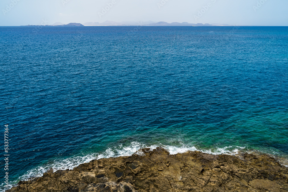 Rocky coast of the Atlantic Ocean. Playa Blanca. Lanzarote. Canary Islands. Spain. Rocky coast of the Atlantic Ocean. Playa Blanca. Lanzarote. Canary Islands. Spain.