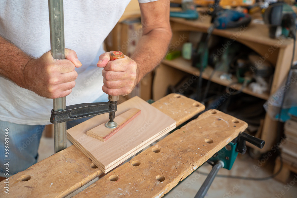 Senior carpenter working on wood craft. Professional tools for crafting. DIY maker and carpentry work concept. Senior carpenter working on wood craft. Professional tools for crafting. DIY maker and carpentry work concept.